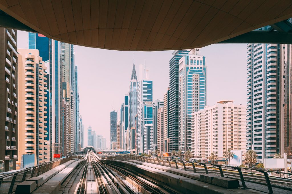 Modern Dubai Metro. Metro railway among glass skyscrapers in Dubai.